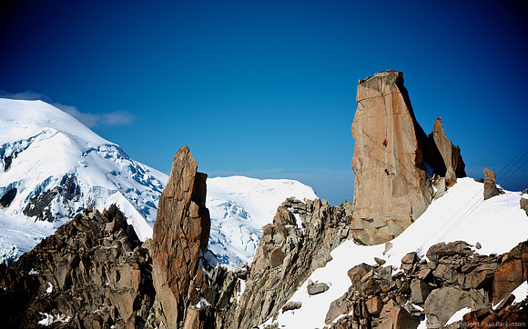 Climbers on Arête des Cosmiques near the summit of Aiguille du Midi