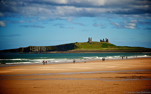 Dunstanburgh Castle ruins from Embleton Bay, Northumberland