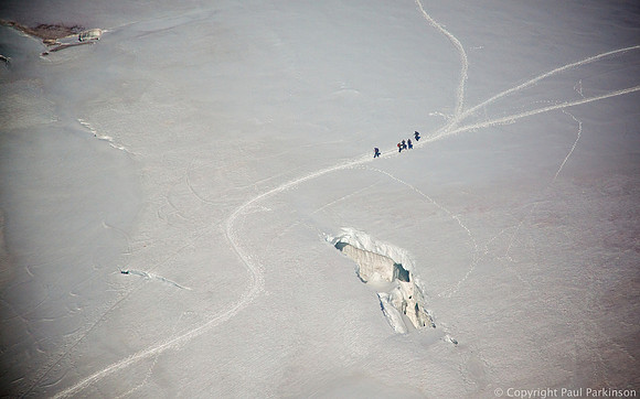 Mountaineers crossing a glacier